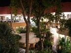 The design was very open, with shops along the perimeter of a central open area with tall trees, waterfalls, etc.
