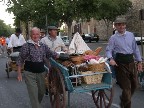 Bread and beer being joyfully toted along