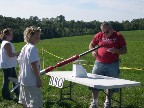 Kevin checks in a rocket made of soda bottles.
