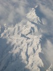The low morning sun casts deep shadows across the snow-covered beauties.